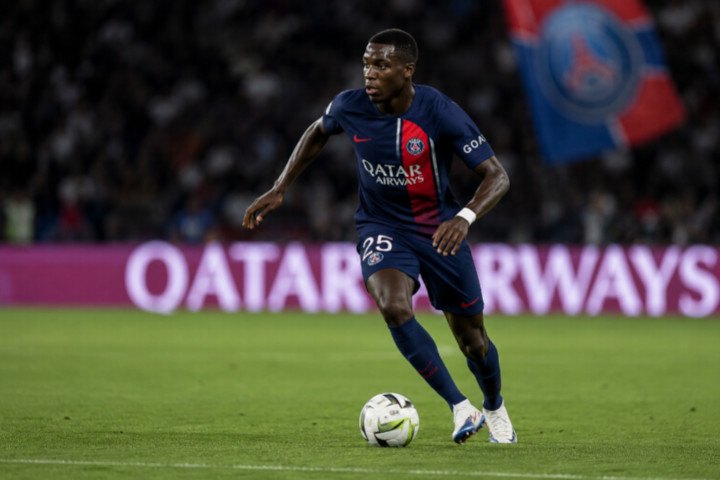 PSG player with a ball attacking on a stadium